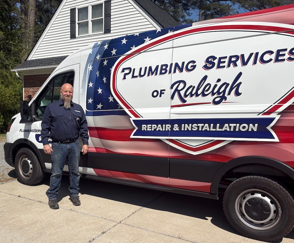 David Dobbs, owner of Plumbing Services of Raleigh, with his branded service van serving Garner
